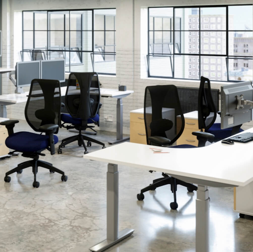 Big&tall office chairs ergonomic office chair adjustable arms midnight black mesh and midnight fabric seat open office view Big&tall office chairs ergonomic office chair adjustable arms midnight black mesh and midnight fabric seat open office view